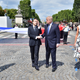 Donald Trump and Emmanuel Macron, flanked by Brigitte Macron (left) and Melania Trump during a long-lasting Bastille Day handshake on July 14, 2017.